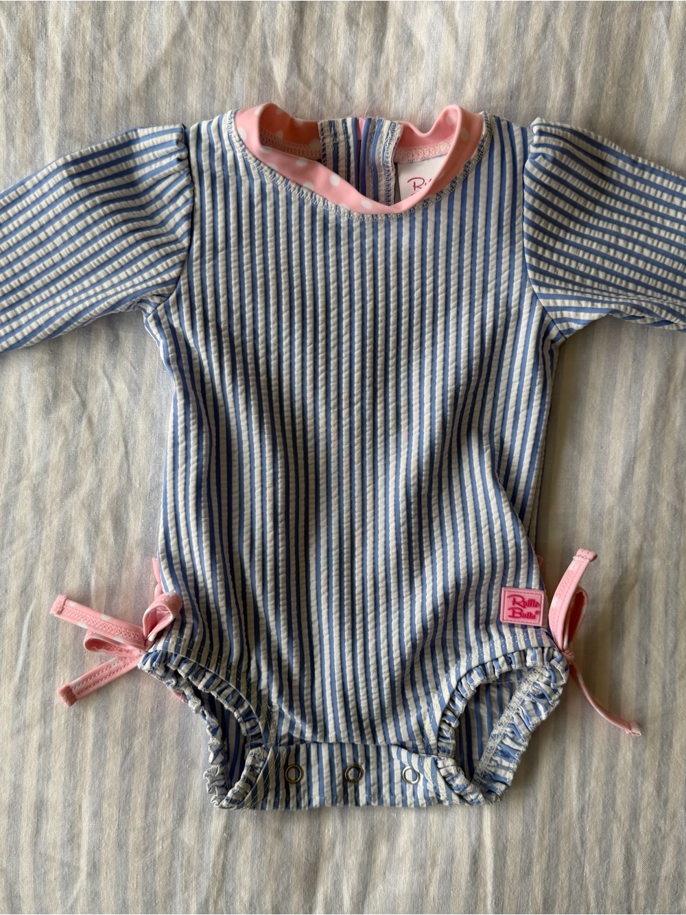 Ruffle Butts Blue & White Stripe One-Piece with Pink Trim